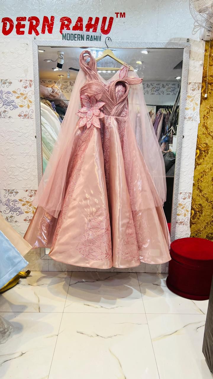 Luxurious Rose Gold Satin Structured Gown with 3D Flower Applique & Sheer Cape Sleeves – Designer Evening Party Wear