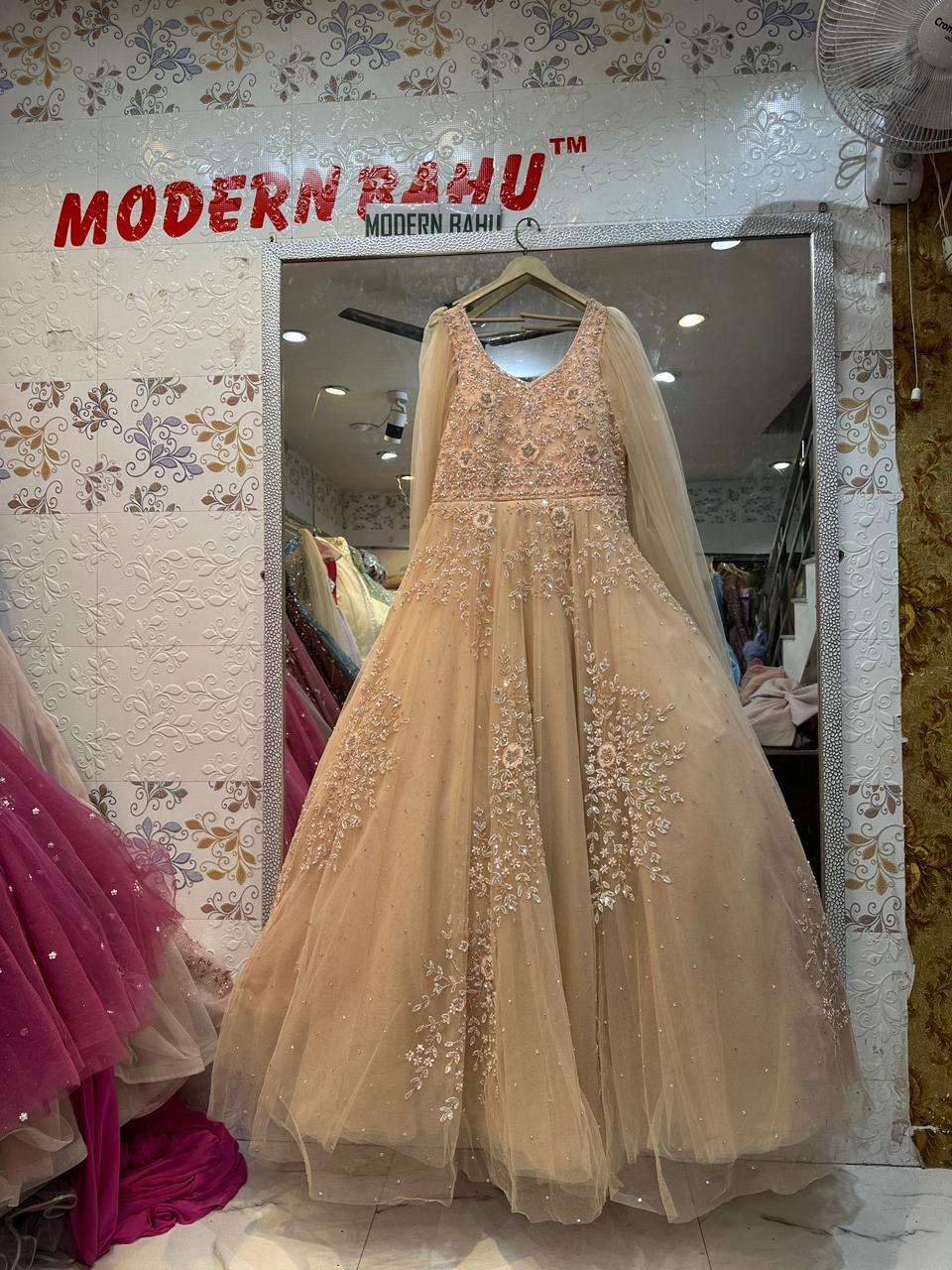 Elegant Peach Net Gown with Floral Sequin Embroidery & Floor-Length Cape Sleeves – Engagement & Party Wear