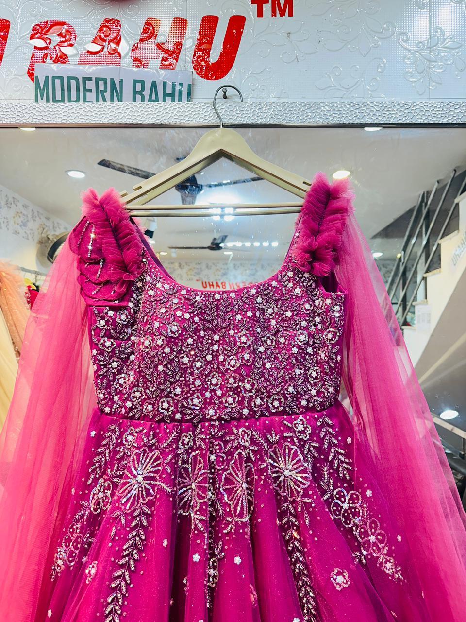 Vibrant Fuchsia Pink Net Gown with Ruffled Shoulders & Crystal Floral Embroidery – Party & Sangeet Wear