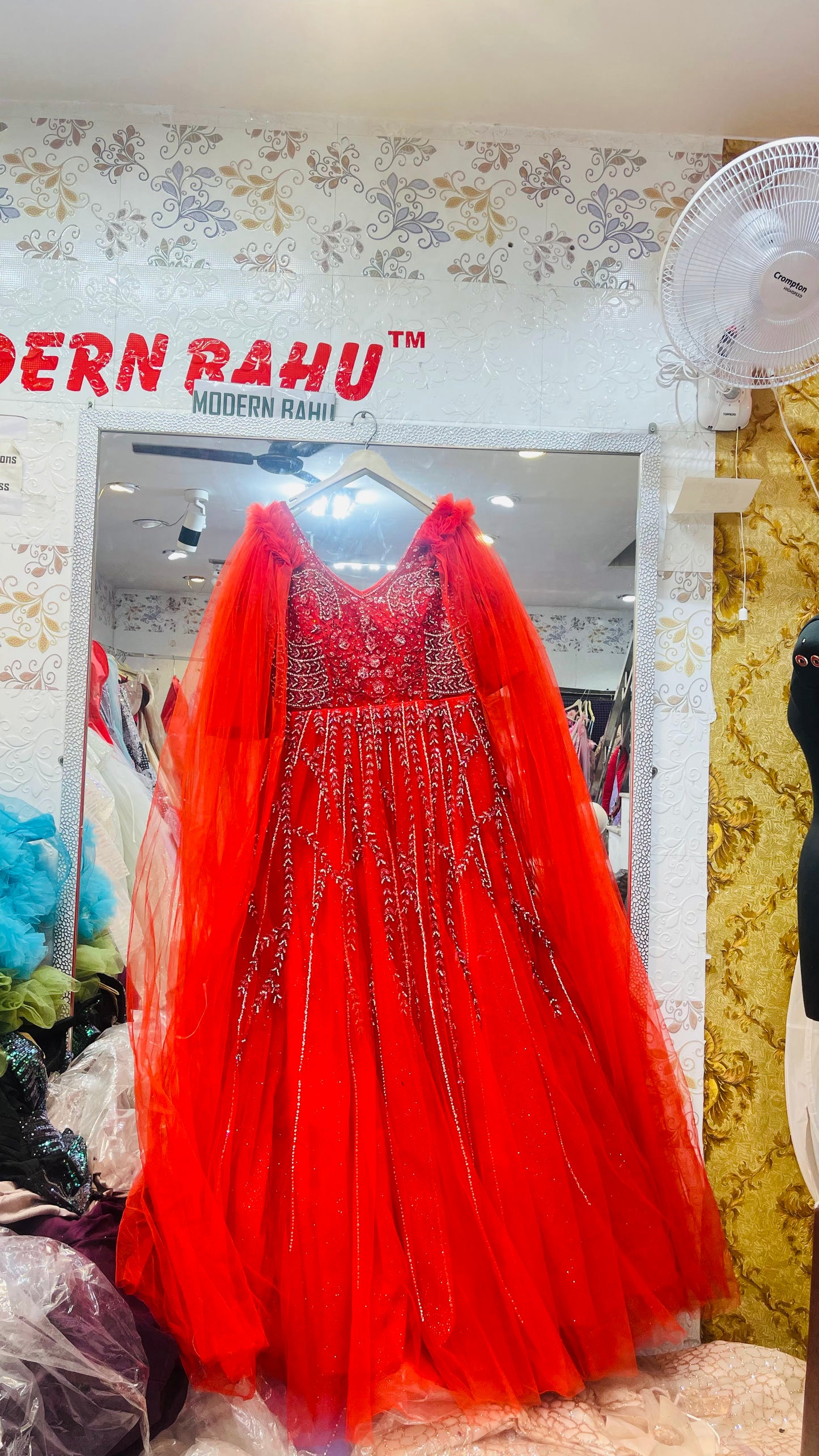 Elegant Red Sleeveless Net Gown with Silver Floral Vine Embellishment