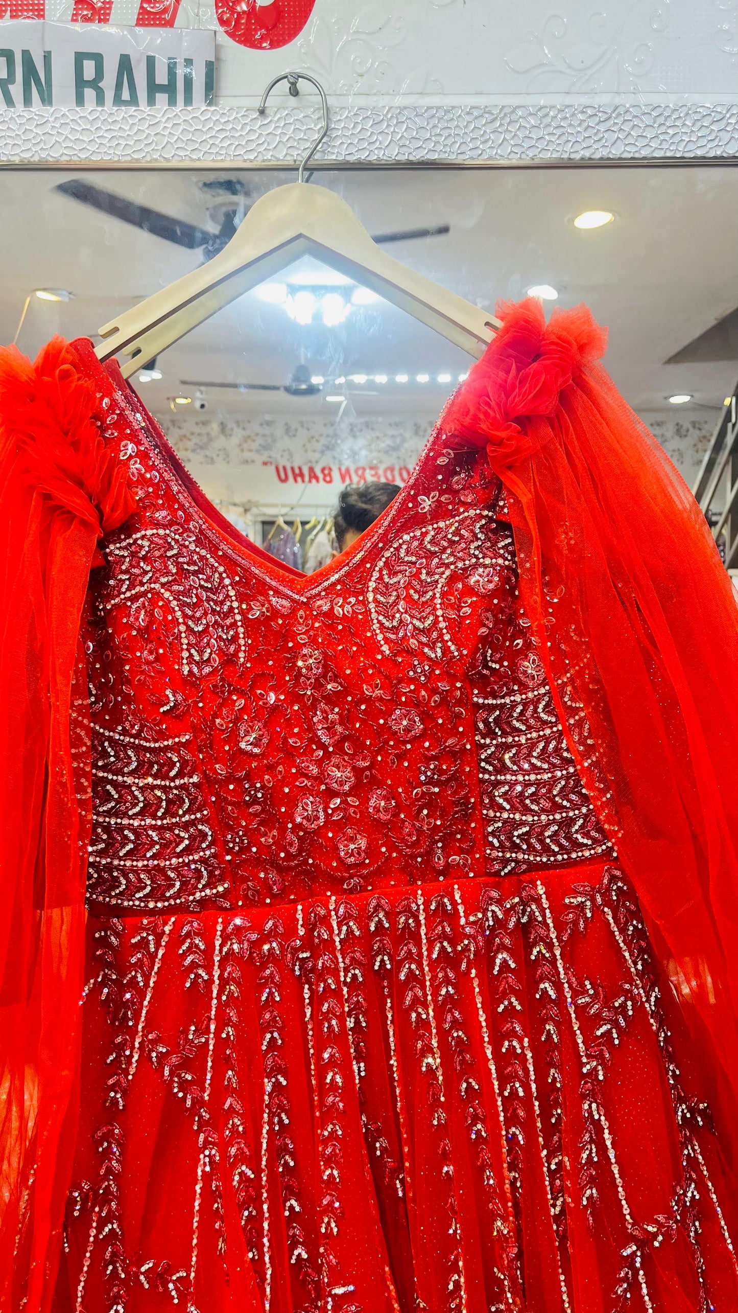 Elegant Red Sleeveless Net Gown with Silver Floral Vine Embellishment