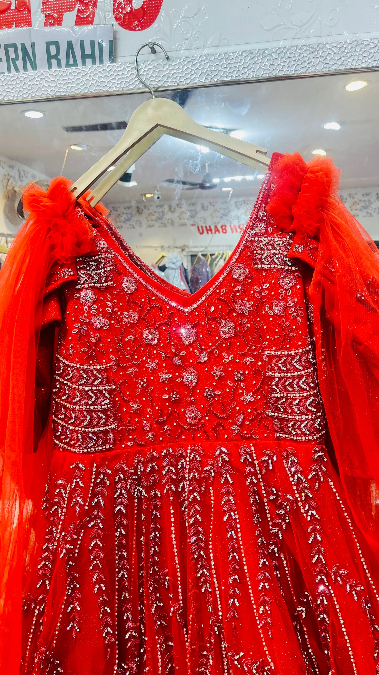 Elegant Red Sleeveless Net Gown with Silver Floral Vine Embellishment