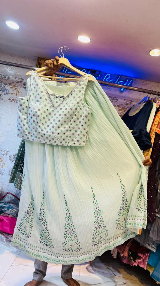 Pastel Mint Green Pleated Lehenga Choli with Mirror Work Blouse & Floral Motifs – Summer Wedding Wear