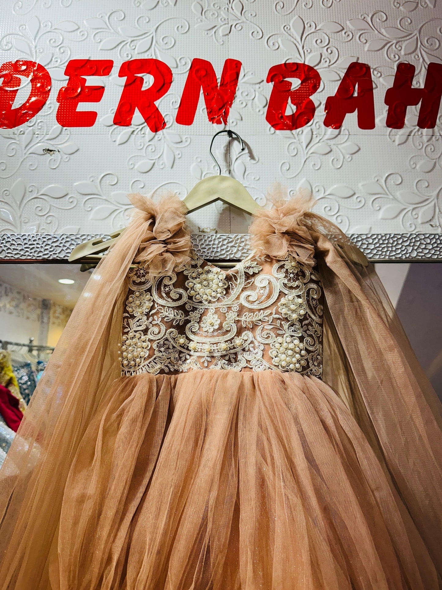Peach Pearl Embroidered 3-Tiered Net Ball Gown with Ruffled Cape Sleeves