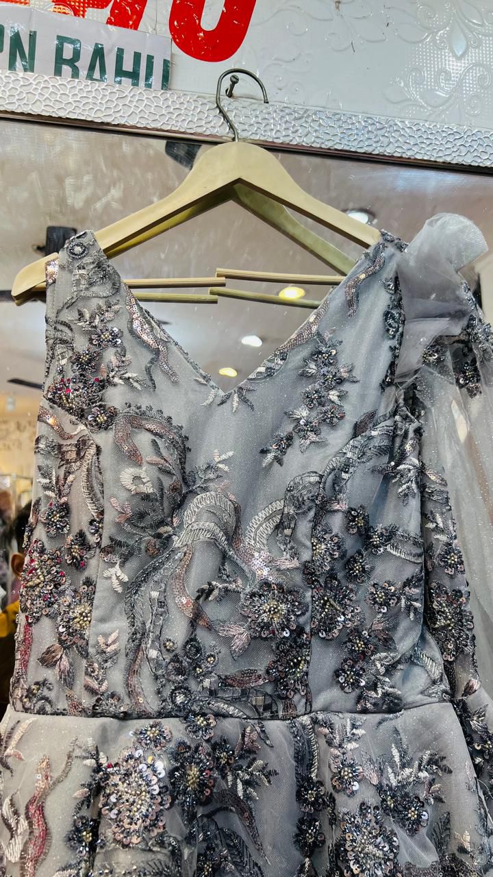 Elegant Silver-Grey Tulle Ball Gown with Intricate Floral Sequin Embroidery & Ruffled Shoulder Detail – Premium Evening Party Wear