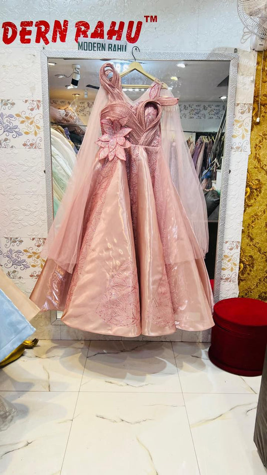 Luxurious Rose Gold Satin Structured Gown with 3D Flower Applique & Sheer Cape Sleeves – Designer Evening Party Wear