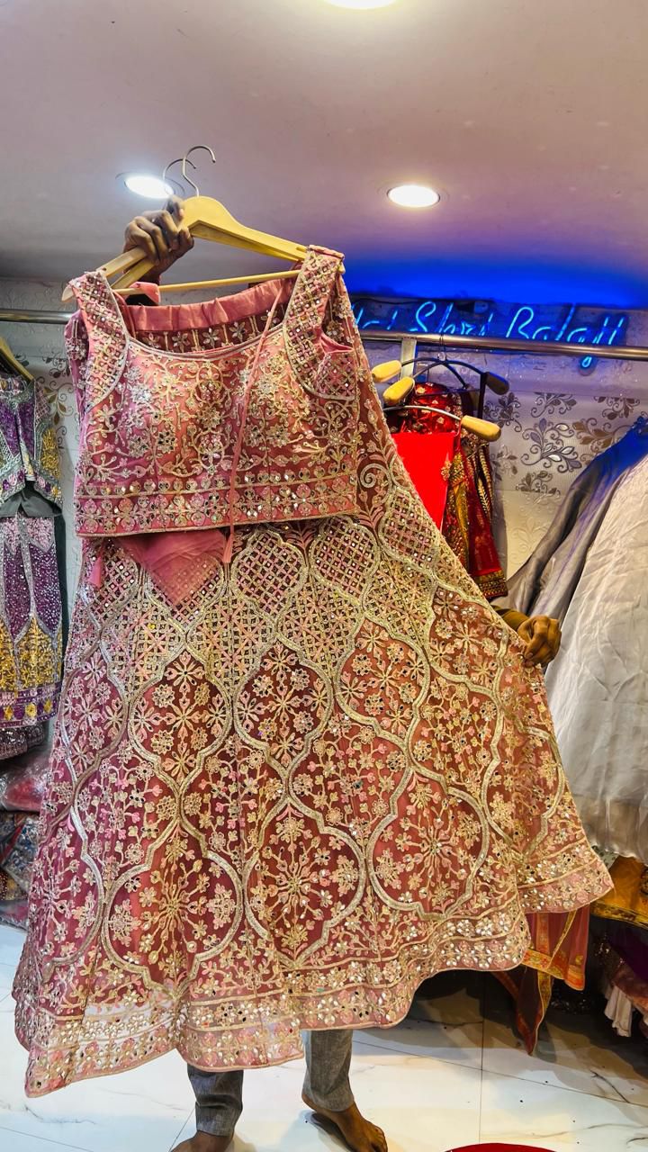 Luxurious Dusty Pink Net Lehenga Choli with Heavy Mirror & Geometric Floral Embroidery – Wedding Collection