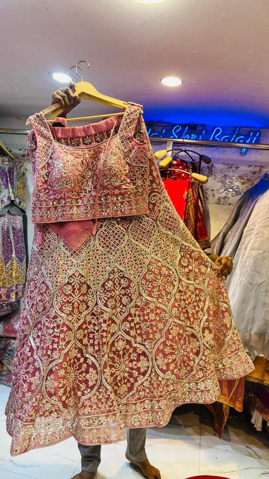 Luxurious Dusty Pink Net Lehenga Choli with Heavy Mirror & Geometric Floral Embroidery – Wedding Collection