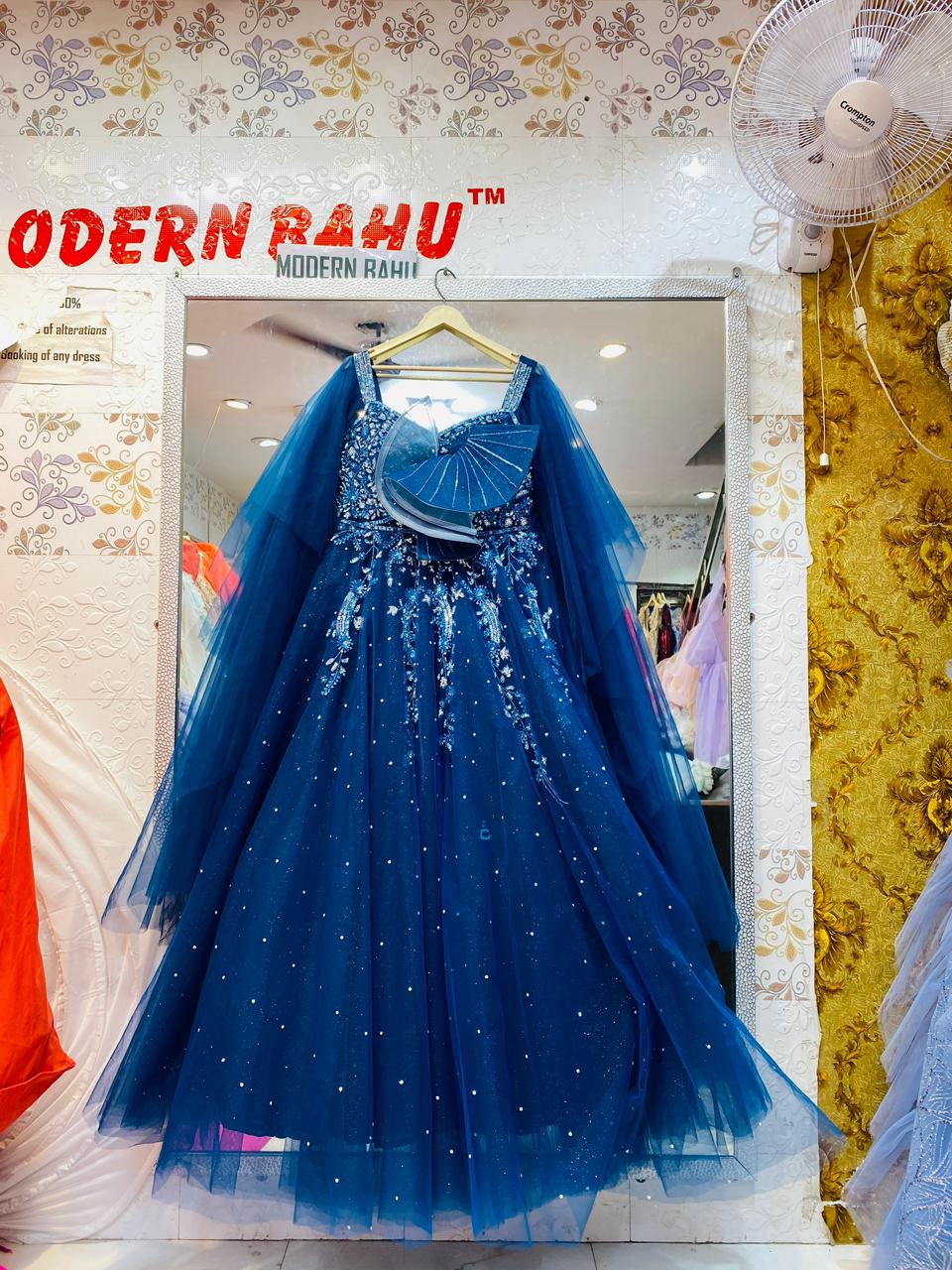 Majestic Royal Blue Tulle Ball Gown with Sheer Cape Sleeves & Avant-Garde Fan Detail – Designer Evening Wear