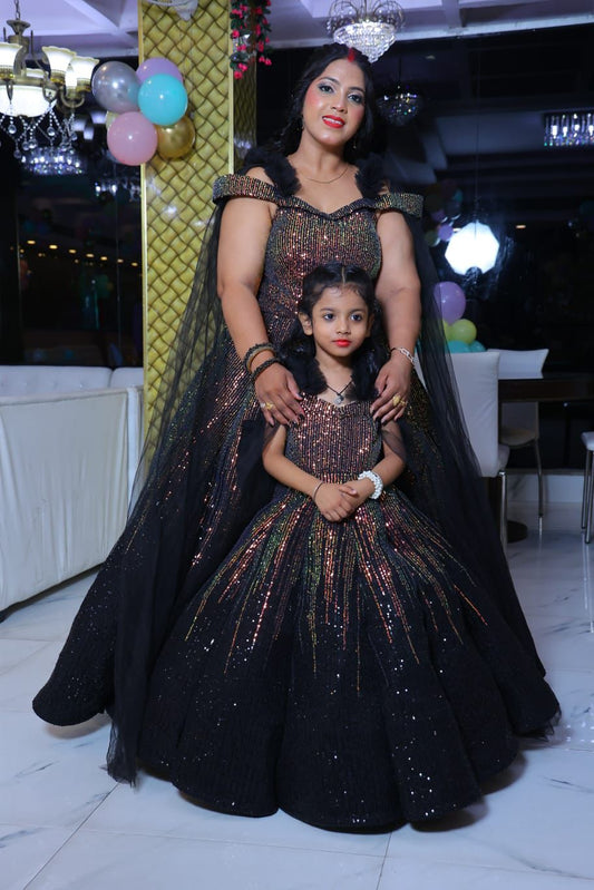 Glamorous Black & Iridescent Sequin Mother-Daughter Matching Ball Gowns with Dramatic Sheer Cape Sleeves