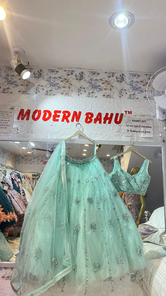 Refreshing Mint Green Net Lehenga Choli with Heavy Mirror Work & Scattered Floral Motifs – Party Wear