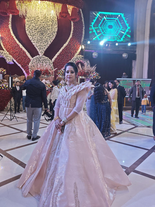 Majestic Peach Satin Ball Gown with Sculpted Ruffled Shoulders & Vertical Silver Embroidery – Royal Reception Wear