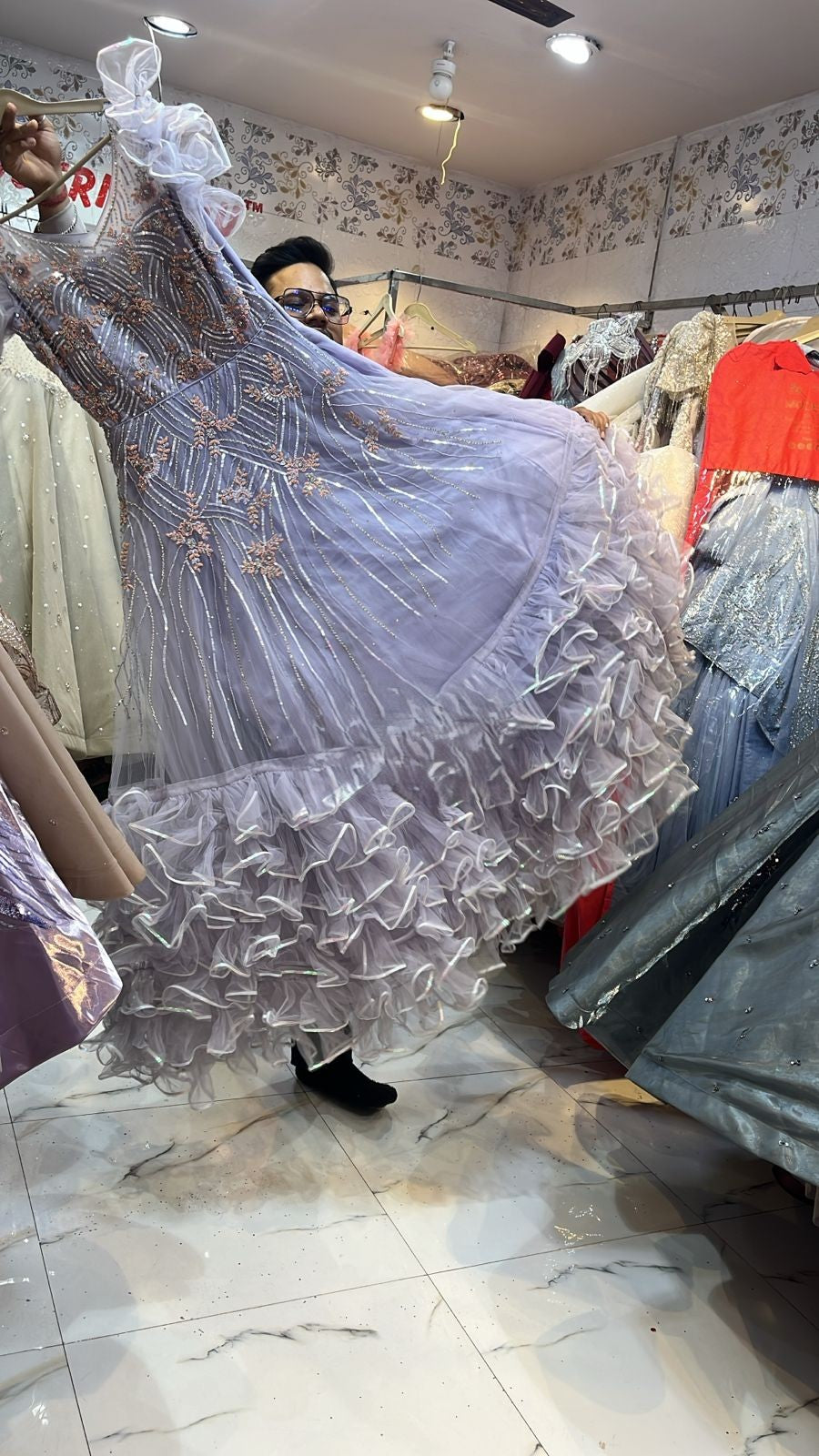 Lavender Sequin Embellished Net Gown with Voluminous Ruffled Hem – Designer Party Wear for Women